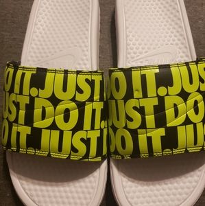 White and green Nike slides